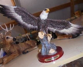 Eagle landing on branch cast figurine
