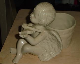 Ceramic cherub playing violin