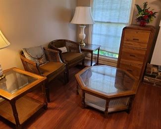 Glass coffee and end tables, cane barrel back chairs. File cabinet not for sale.