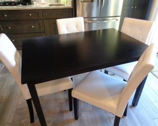 Parsons dining table and four faux-leather Parsons dining chairs