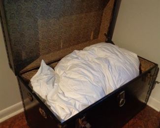 interior of vintage trunk, vintage down-filled duvet comforter