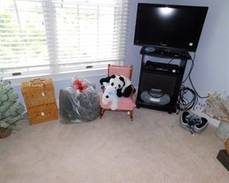 TV, child's chair, and baskets