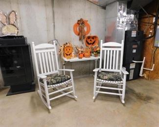 White porch rockers and Halloween ornaments