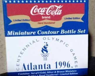 Miniature Coca Cola Bottle set from the Atlanta 1996 Centennial Olympic Games.  Box is  4inch by 4 inch.  Bottles are 3 inches tall, 