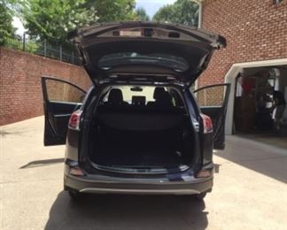 Photo from the Rear featuring the wide trunk space for this 2018 Toyota RAV 4 Limited FWD SUV