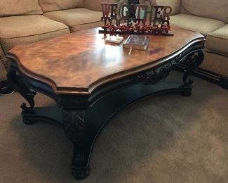 Ornate wood finish and iron heavyweight coffee table