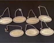 7 LIQUOR DECANTER NAME PLATES W/ CHAINS
