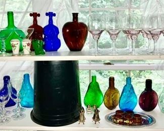Colored glass bottles, stemware