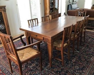 REDUCED!  $500.00 NOW, WAS $800.00.................Walnut Dining Set.  Custom made in Grazia’s home town of Treviso, Italy in the early 1980s by a local artisan. Measures: 88.5”L x 37”W x 31.5”H
There is a 17”L self-storing leaf at each end of the table
Set includes 6 chairs (16.5”L x 14”4/4”W x 36”H; seat is 18”H) and 2 armchairs (21”1/4”L x 18”1/4”W x 37”H; seat is 18”H) Table can sit 8 to 12 people when fully elongated by use of the two leaves. The top of the table has a few heat and water marks & scratches. 
