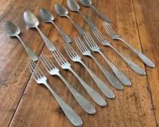 CLEARANCE !  $10.00 NOW, WAS $25.00................Brass Forks and Spoons.  Belonged to Grazia’s maternal grandparents, early 1900’s. They are about 8”L with some of the spoons being slightly shorter.