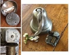 $10.00................Pewter Bell Circa 1957.  Was a gift to Grazia’s parents when she was born. The bottom of the bell (wood) needs to be put back in its place with appropriate screws. Carillon used to work when properly placed inside the bell, needs to be reconnected to the crank for winding.
Bell has a diameter of 4” and is 4”1/4”H 