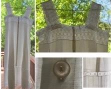 REDUCED!  $37.50 NOW, WAS $50.00....................Sleeveless gown, #1
Original hand made mother of pearl buttons.The lace at bottom and top of gown has little vertical cuts that served to pass a silk ribbon all around the gown. The original silk ribbon was very brittle and came off during washing. A new ribbon could be easily put back in place.
