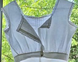 REDUCED!  $18.75 NOW, WAS $25.00..................Sleeveless blouse, #13
Only two of the original mother of pearl buttons are left.
