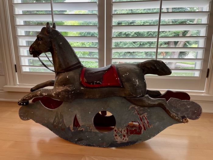 CLEARANCE !  $250.00 NOW, WAS $600.00..................Antique Rocking Horse, belonged to Grazia’s dad when he was a child in the Sicilian town of Messina, Italy. 
Base is wood, horse is some kind of plaster
Rocking Horse: 39.5”L x 7”W x 25”H                                Slight damage from our puppies on the two posterior horse hooves. Color has been scraped off in several spots. 