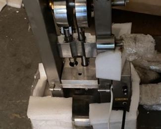 Can you identify this heavy stainless steel -some kind of press. Brand new with all accessories -best offer  