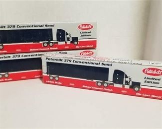 3 each 1/64 scale Peterbilt semi / 2 are banks / 1 - 379 conventional semi/ Warner Enterprise/Crossroads/Monford NIB