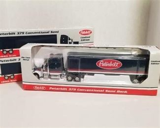 2 each 1/64 scale Peterbilt semi / 1 banks / 1 - 379 conventional semi/ Pepsi /Warner NIB