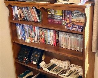 Office phone grouping, boom box, and various vhs tapes.