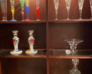 Top right: Waterford champagne flutes, Steuben bowl or vase right middle, Orresfors bowl, Waterford carafe and bell lower right. Nambe bowl lower left