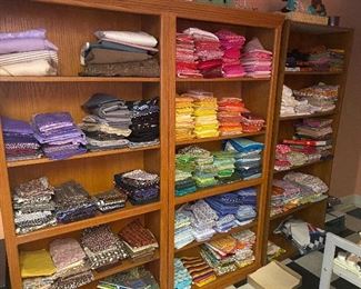 3 bookcases and fabric pieces