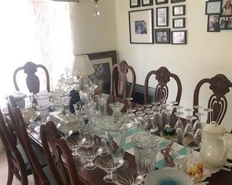 Partial display of Princess House Chrystal, many collector items, Dining room table seats 10 with 2 leafs. Comes with 6 chairs and 2 arm chairs.