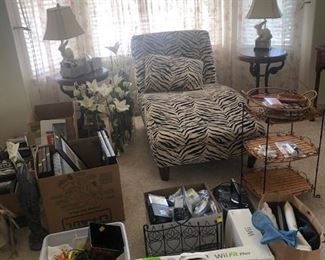 Zebra print chaise lounge, rabbit lamps, swan end tables, 