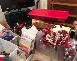 Christmas items:Gift boxes, gift bags, wreath, ornaments, stockings, pillows, large red tote full of silk poinsettias used to finish out Christmas tree