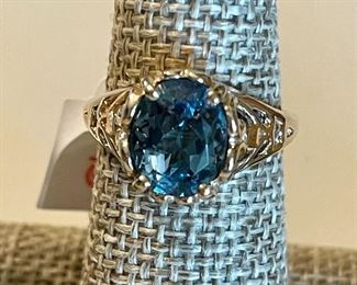 blue topaz and gold solitaire
