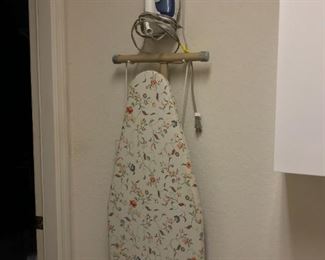 Rowenta iron and ironing board.