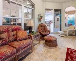 4-piece rattan patio set: love seat, table chair & ottoman