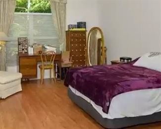 Chaise lounge chair, Singer sewing machine & cabinet, cane chair, 8-drawer cabinet, oval mirror and full size adjustable bed.