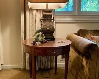 There are a pair of these Baker end tables, and a pair of the James Mont style lamps