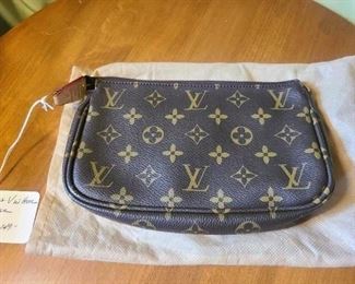 Louis Vuitton clutch*$149.00