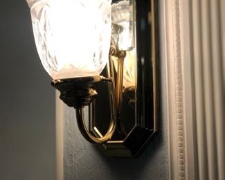 2 brass and crystal sconces