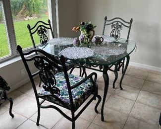 WROUGHT IRON TABLE AND 4 CHAIRS