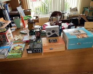 LOTS OF ELECTRONICS INCLUDING KEY FINDERS, CAMERAS, CANON LASER, OFFICE CD'S 