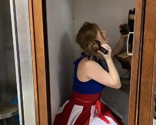 Mary Lou enjoying a phone conversation in this 1950 phone booth by Western Electric (Photos by BC of Capitol Sales Services ) ...To Register and To Bid go to https://capitolsalesservices.hibid.com