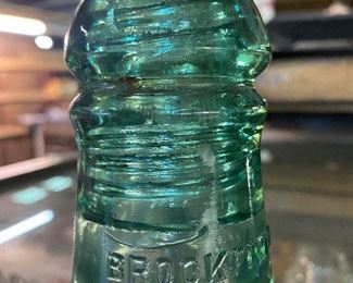 Old Brookfield glass insulator...........To Register and To Bid go to https://capitolsalesservices.hibid.com..