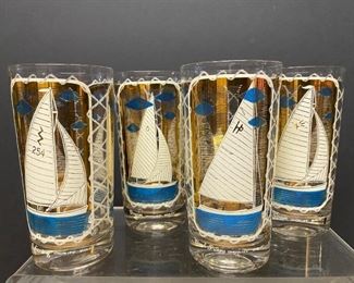 Vintage glass tumblers each with a specific type of sailboat.  