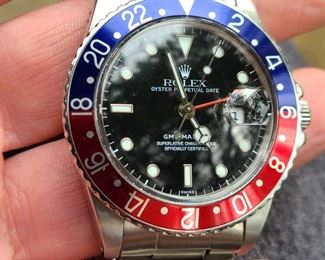 1. Men Rolex GMT Master black face blue red beze upclose