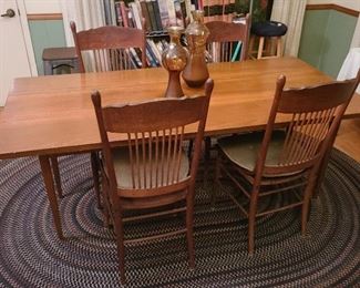 3. dining table and braided oval rug