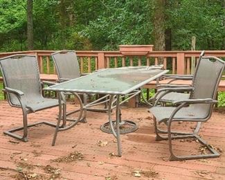 Glass top table and 4 chairs patio set