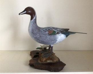 hand carved decoy on stand 