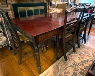 Table extends as shown chairs with rush seats