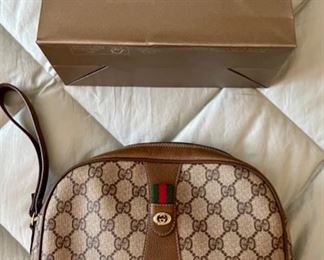 Rare vintage Gucci logo wristlet in mint condition.
