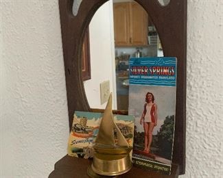 Mirrored Shelf, brass musical Sail boat, vintage postcards and vintage FL tourist pamphlet