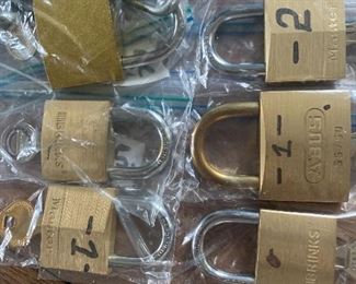 assortment of keyed brass locks