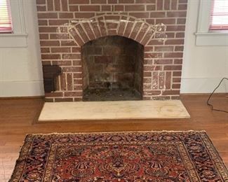 Antique 63" by 75" Rug with a small split and worn pattern