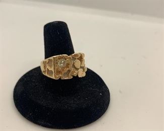 Size 9 14k ( tested 14k) Nugget Ring with small diamond.