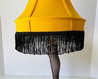 13/  Fishnet stocking Leg Lamp • Yellow with black fringe shade • like new • $30